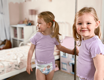 Smiling girl wearing DryNites pants
