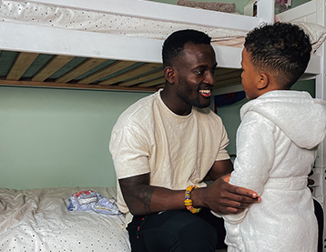 Dad talking to his son at bedtime